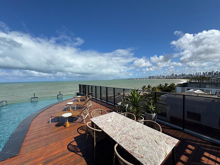 Flat beira-mar pé na areia com varanda